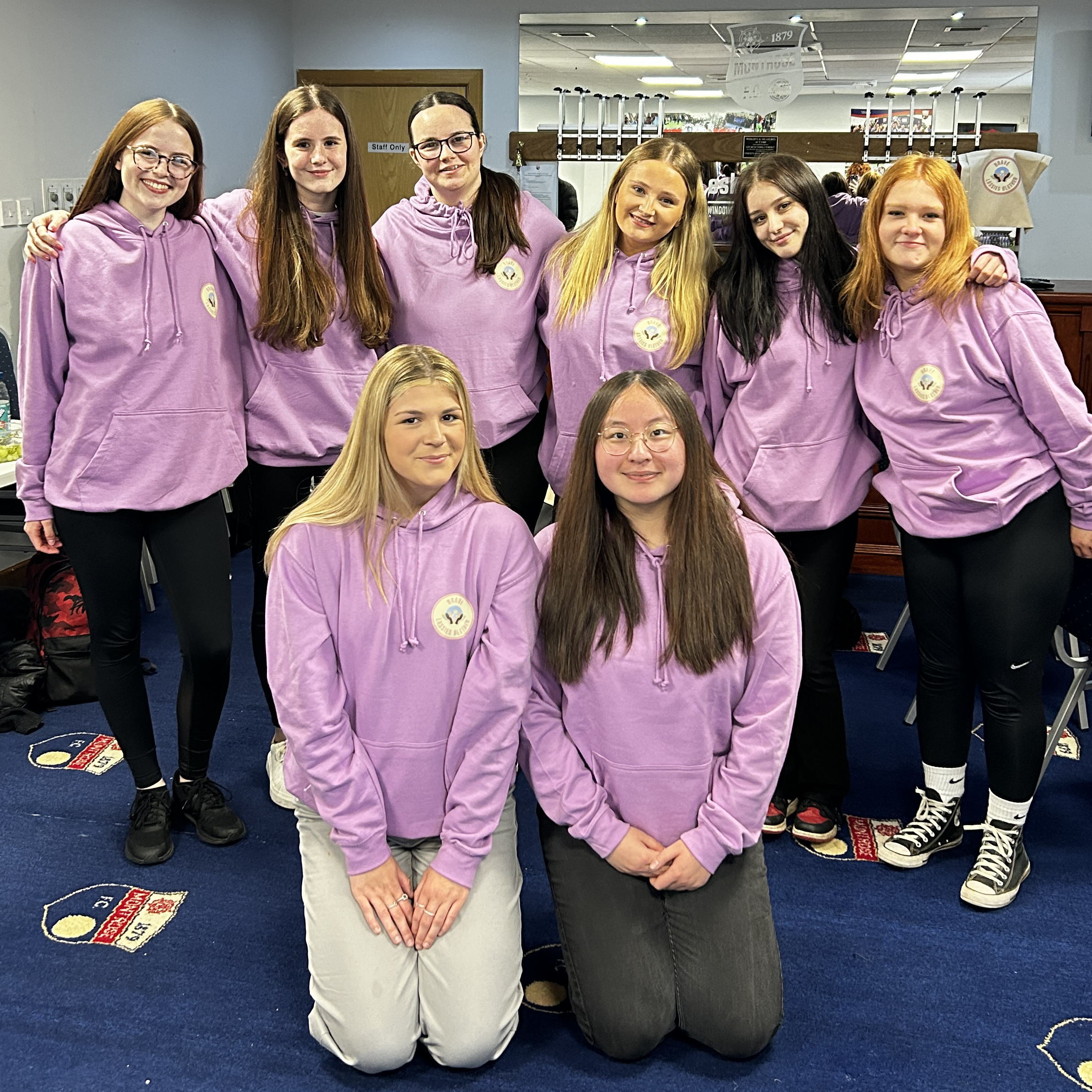 Brave Lassies Blether group in matching purple hoodies