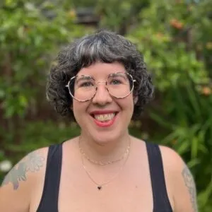 Mar outdoors and smiling at the camera