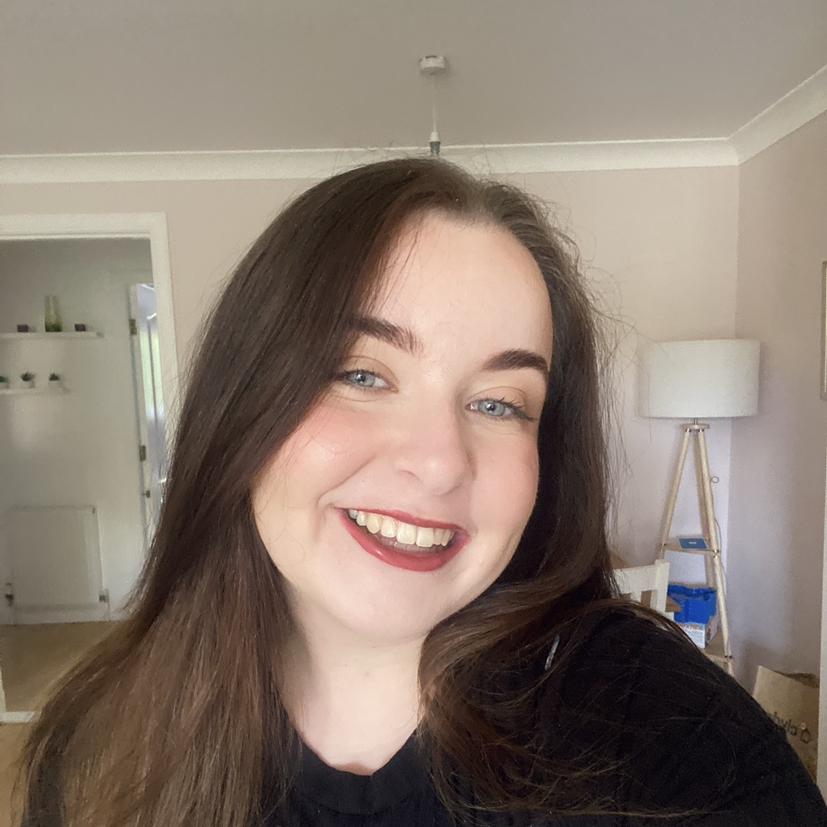 Sam has long dark hair, pale skin and blue eyes.