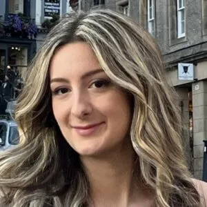 Tamara has pale skin and long blonde hair.