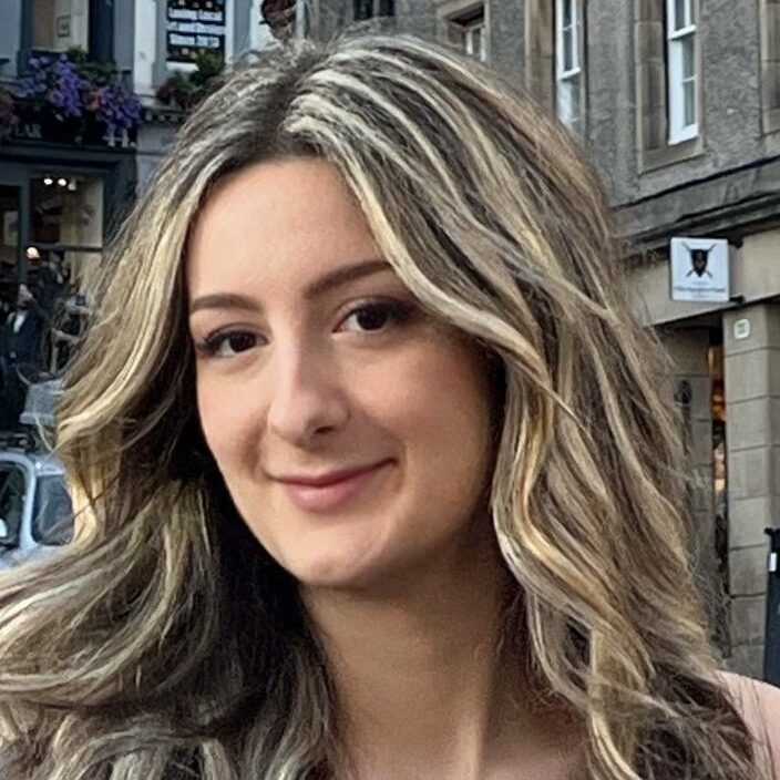 Tamara has pale skin and long blonde hair.