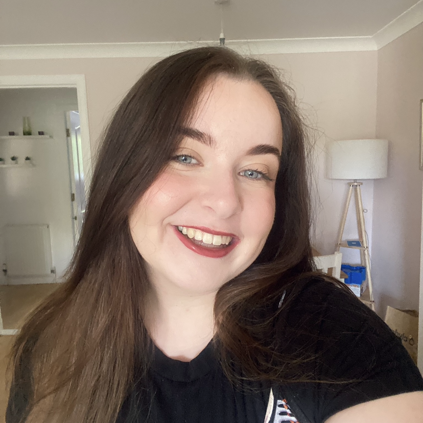 Sam has long dark hair, pale skin and blue eyes.