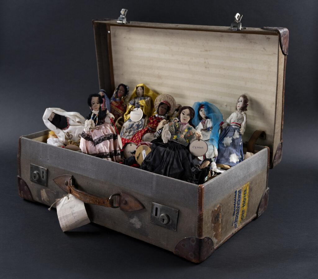 A suitcase full of fabric dolls
