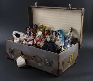 A suitcase full of fabric dolls